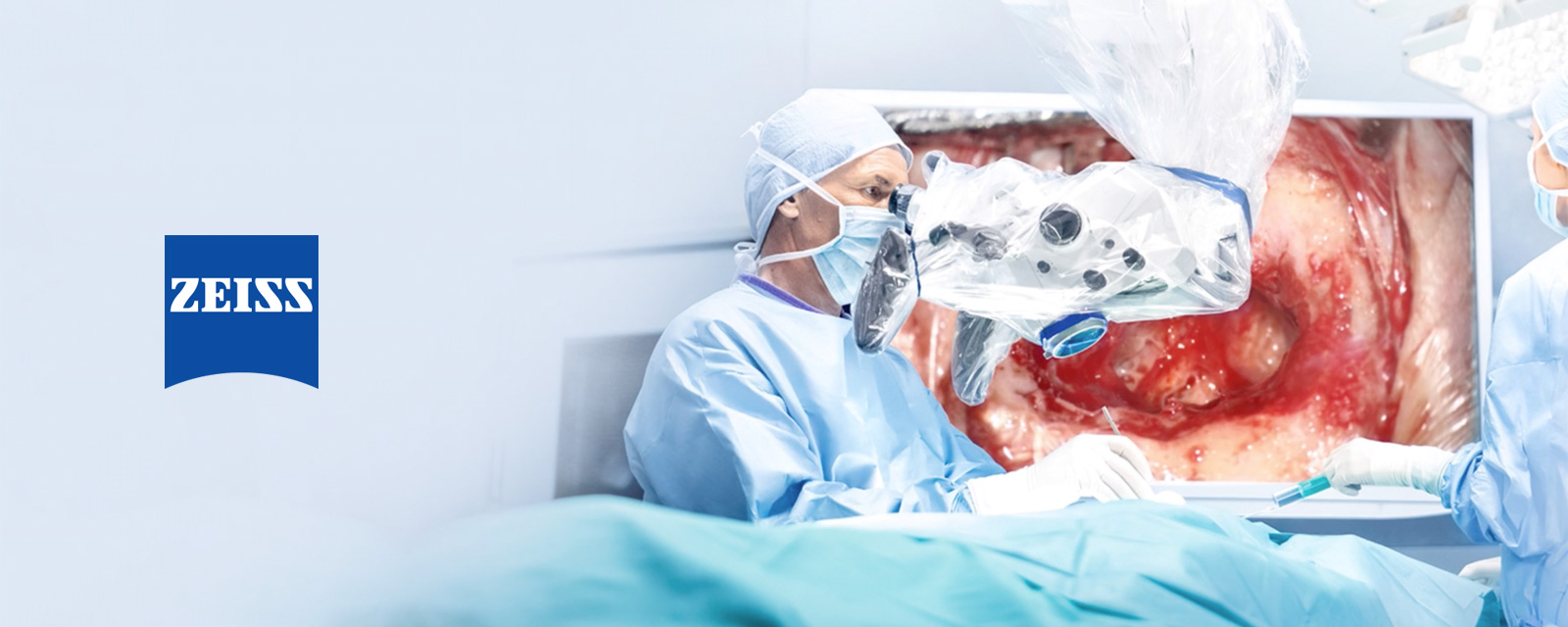Surgeon using microscope during surgery